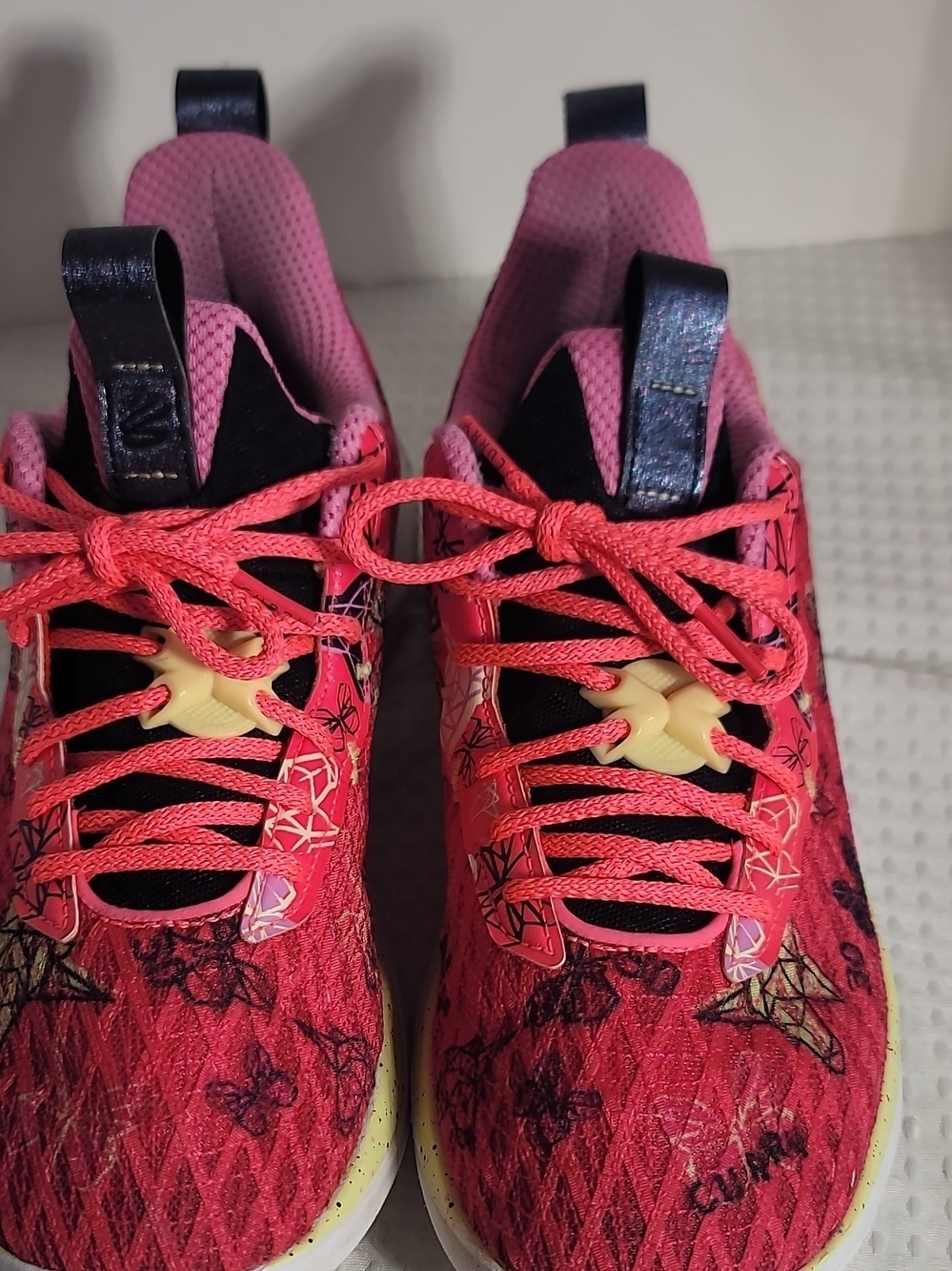 Under Armour Pink and White Athletic Sneaker Label Detail